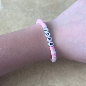 Pink and white xoxo handmaid clay bead bracelet